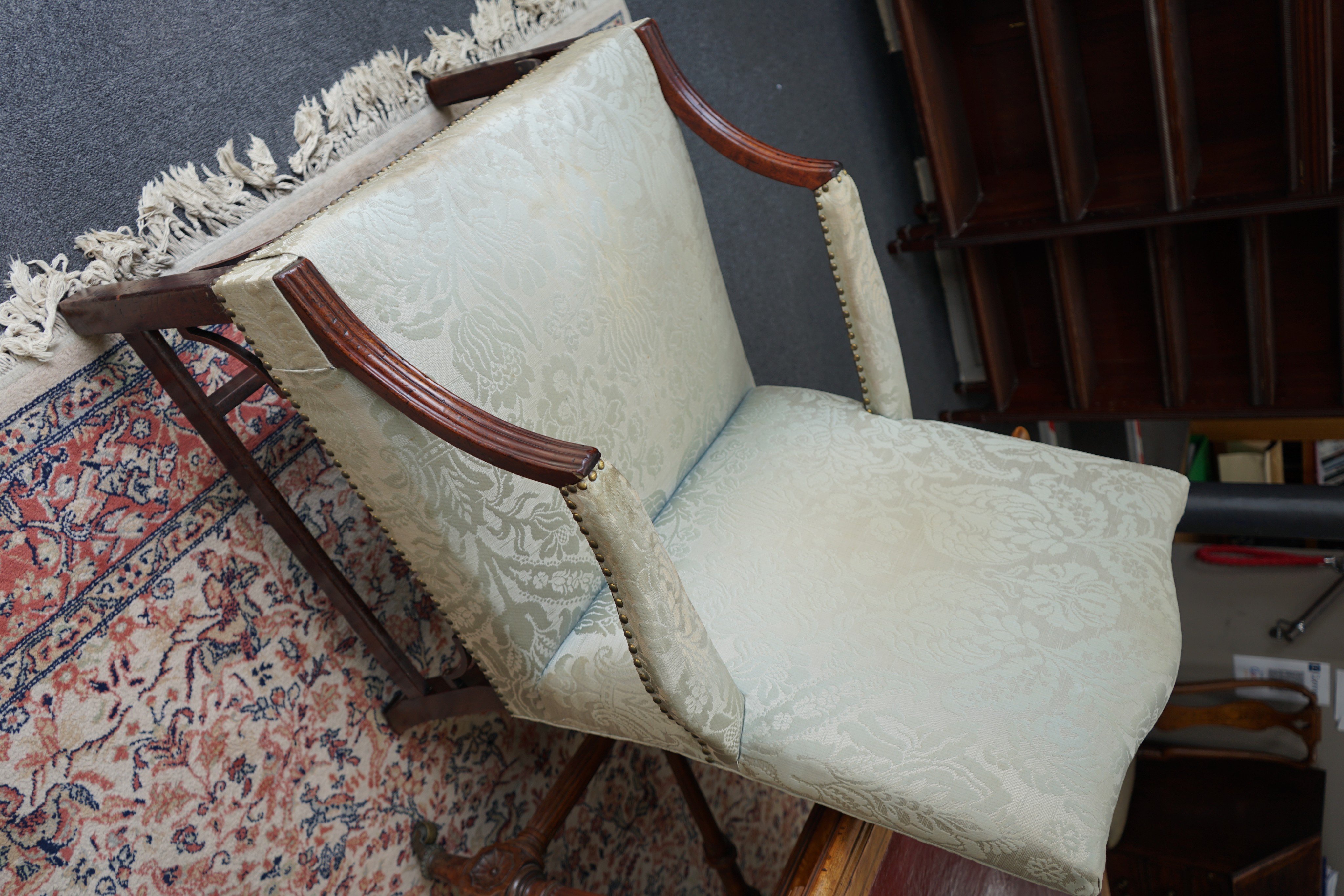 A near pair of George III and later upholstered Gainsborough style mahogany chairs, larger width 70cm, depth 74cm, height 103cm